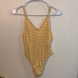 Yellow and white stripped body suit